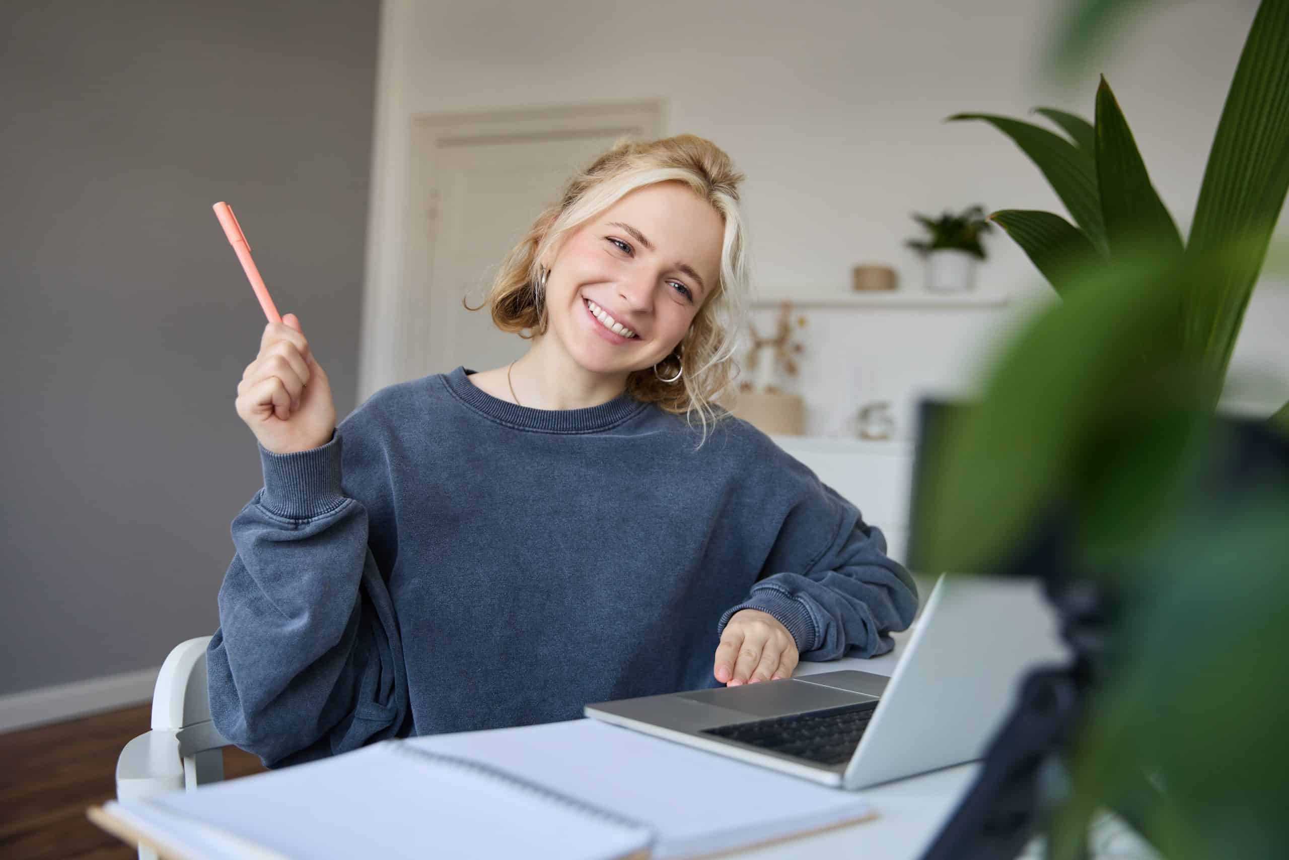 portrait young smiling woman student talking teacher online via video chat doing course scaled